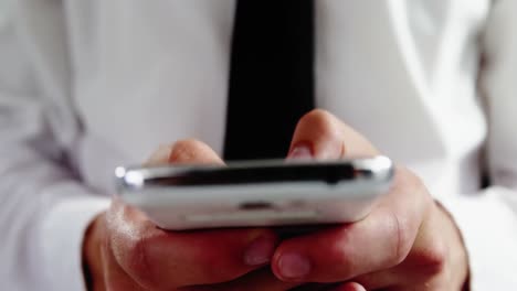 Androgynous-man-using-mobile-phone