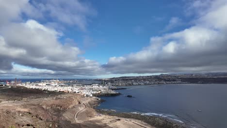 an elevated view of las palmas de gran canaria city. timelapse of the city under a fast changing sky with layers of clouds under a blue sky