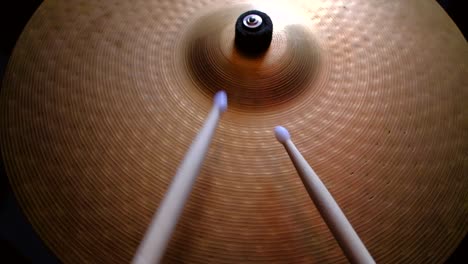 close up drummer playing on drum plate ride