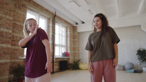 female teacher giving private dance lesson to young woman
