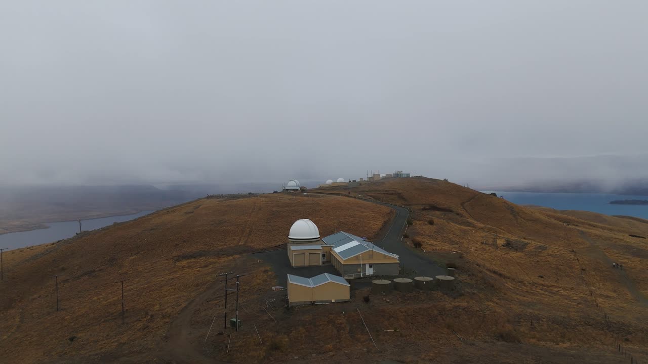Aerial View of Observatory on Hill as Fog Rolls In