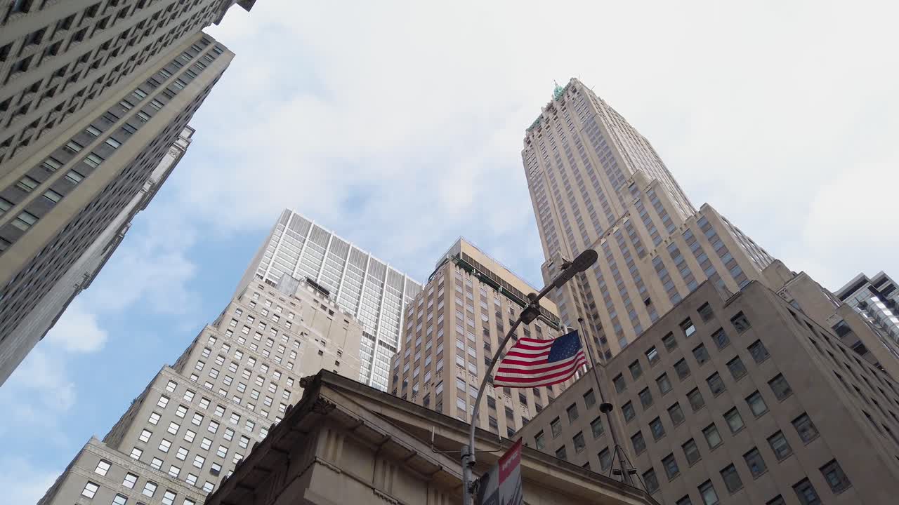 Empire State Building, New York. Low Angle View of Skyscraper and American Flag Under Summer Sky