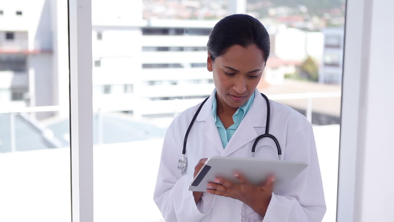 Female doctor using a tablet computer