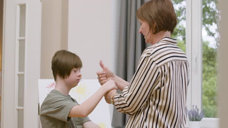 mother and daughter playing with their hands