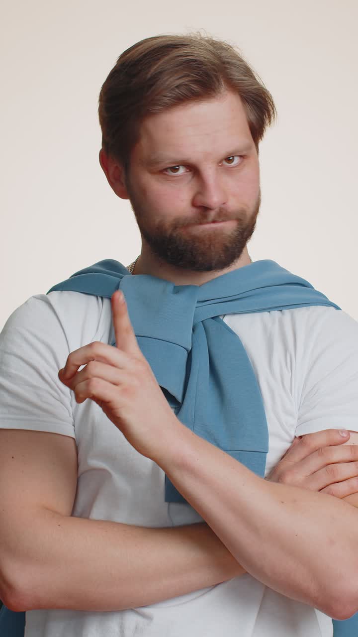 Confused displeased surprised caucasian man pointing fingers hisself rejection refusal stop sign
