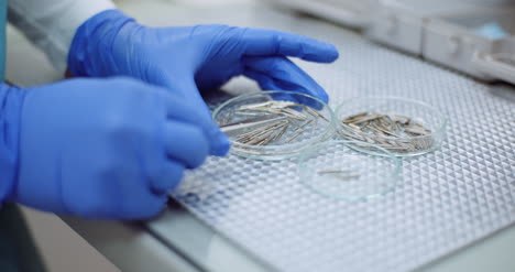 doctor sorts medical instruments at healthcare clinic 4