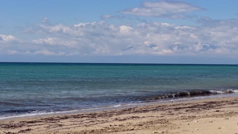 stunning beach scene in halkidiki, greece, with elegant sunbeds facing the crystal-clear turquoise sea. a perfect summer escape in the heart of the aegean.