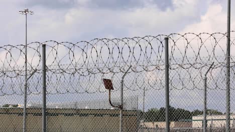 Barbed-Razor-Wire-fence-at-prison-surrounding-jail-in-Texas