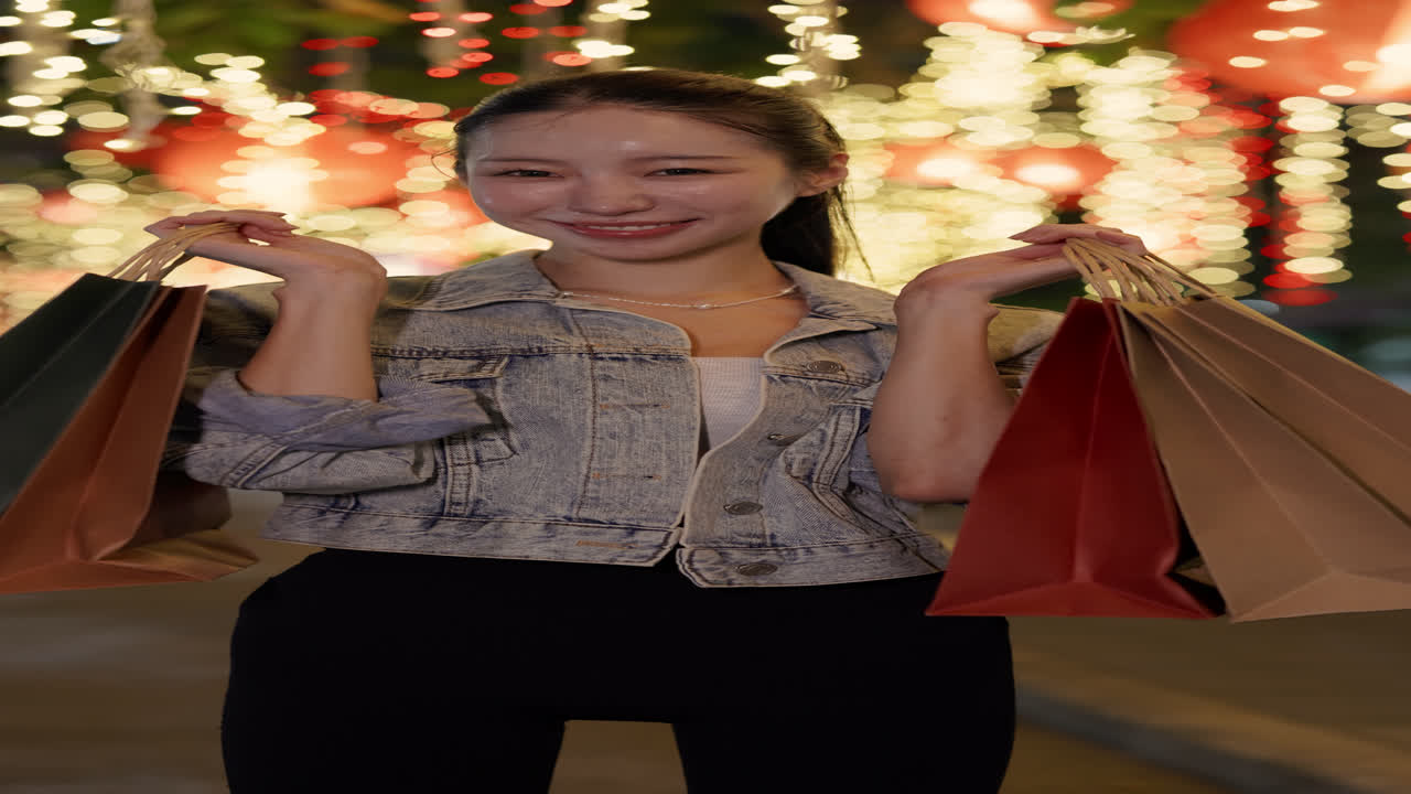 Woman with Shopping Bags in Festive Lighting