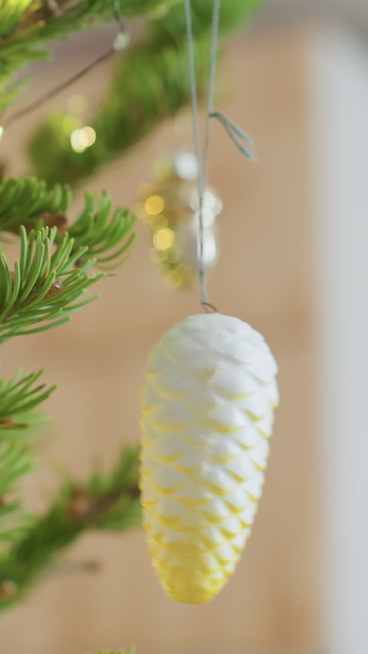 Holiday pinecone decoration, Detailed image of glowing pinecone surrounded by evergreen branches, Richly detailed depiction of festive pinecone adorned with golden lights amidst green foliage