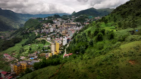 sa pa or sapa city in north-west region of vietnam. aerial forward, drone panoramic view
