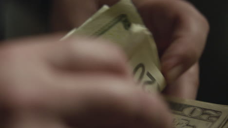 Close-up-of-a-man's-hands-counting-money