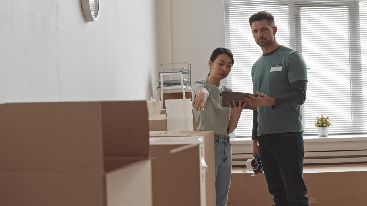 Volunteers packing and moving boxes