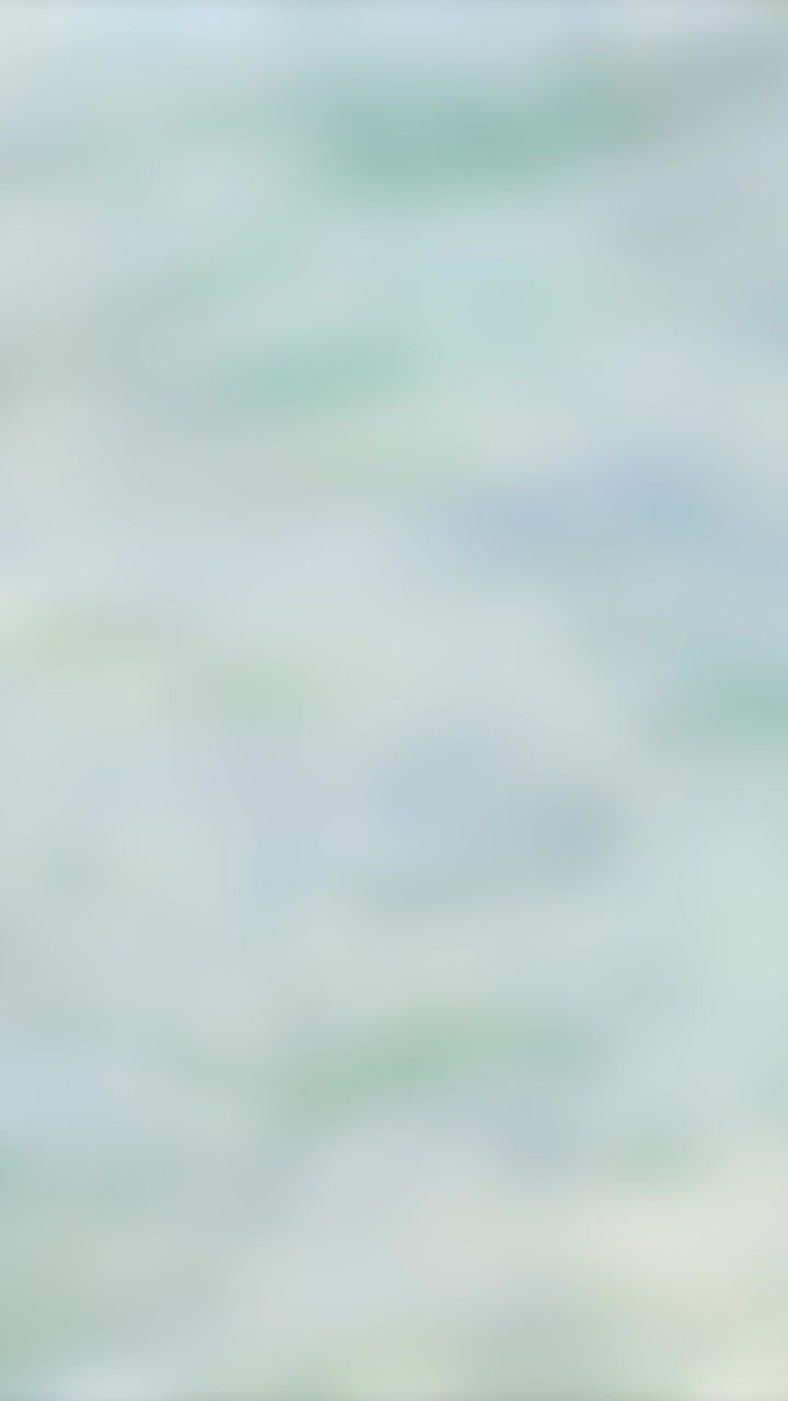 A seamless loop of soft ocean waves creating a calming, textured background with subtle motion and pastel hues