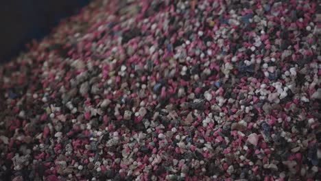 close up shot of pile of raw material particles in factory