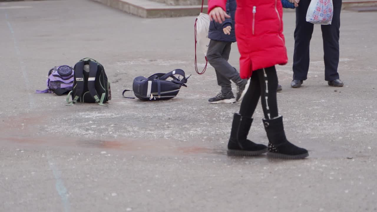Children walking in a schoolyard