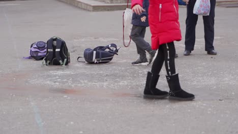 children walking in a schoolyard