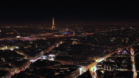 night aerial view of paris buildings with light