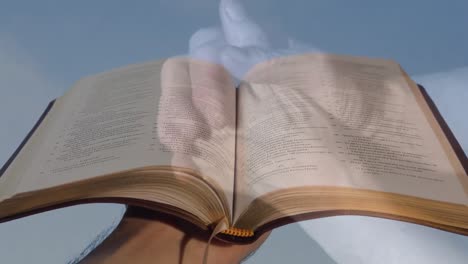 animation of hands of caucasian woman praying over open bible