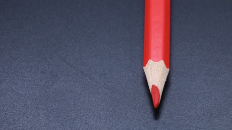 red colored pencil crayon rotating macro shot, zoom close up video