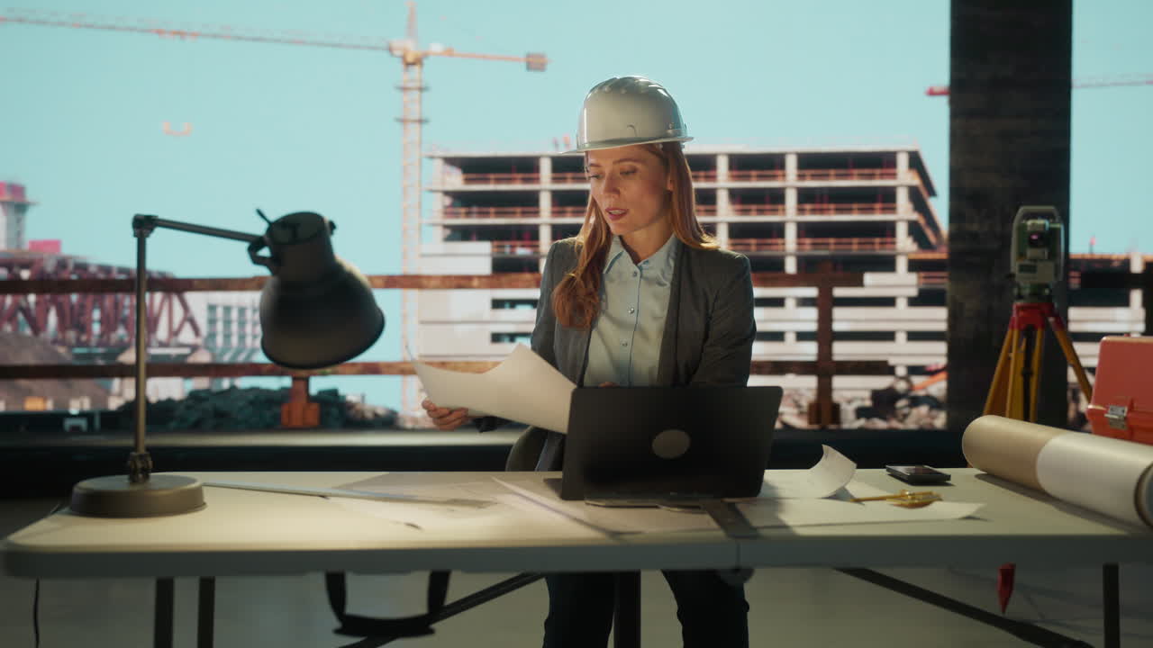 Female Engineer or Architect Working at a Construction Site Desk