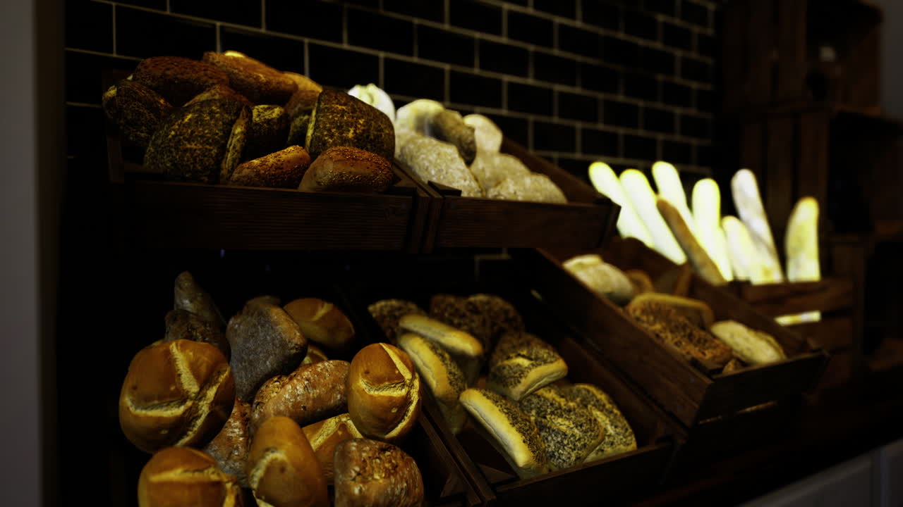 Freshly baked artisan bread displayed in a cozy bakery at dusk
