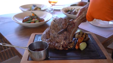 cutting beef steak. an incredible roast..