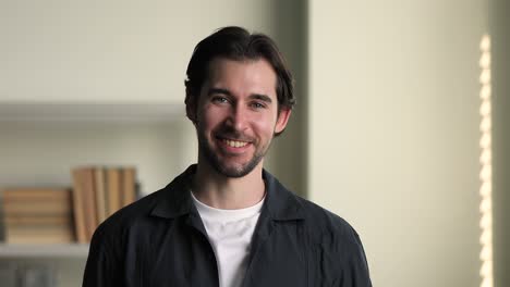 head shot portrait smiling bearded man pose in office