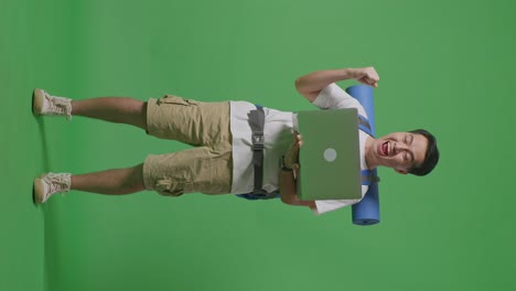 man with laptop and backpack