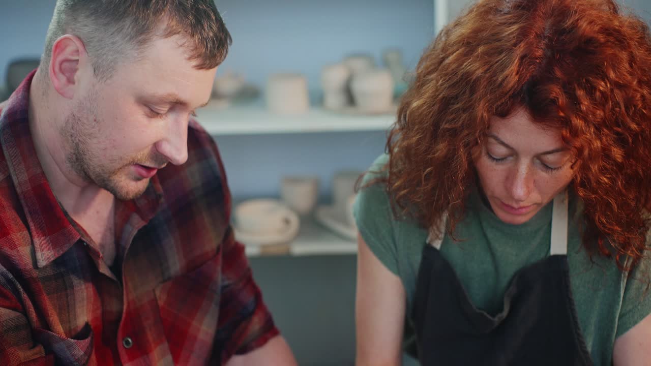 Couple Working Together in Pottery Studio