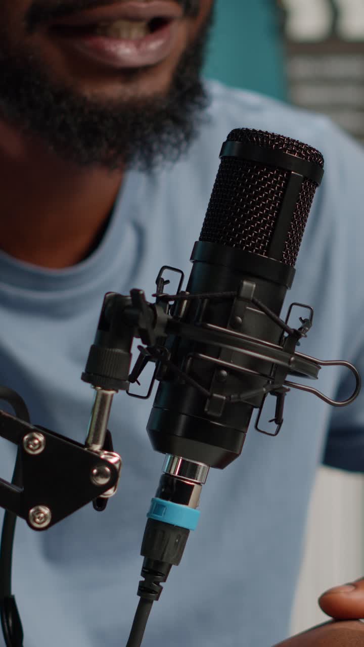 Close-up of a black microphone in use