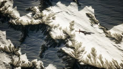 helicopter-above-mountains-in-snow