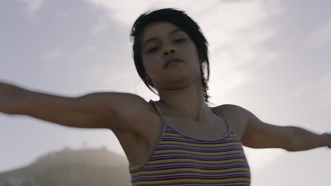 dancing-woman-young-hispanic-street-dancer-in-city-performing-contemporary-moves-enjoying-urban-freestyle-dance-at-sunset-close-up