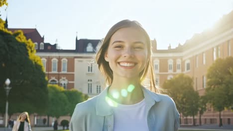 smiling woman on a sunny day at university campus