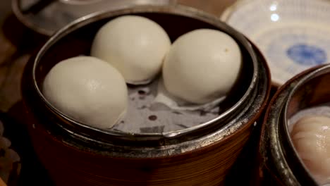 assorted dim sum dishes in bamboo steamers