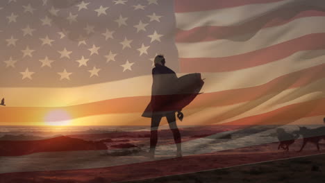 composite video of waving american flag over rear view of a man walking with surfboard at the beach