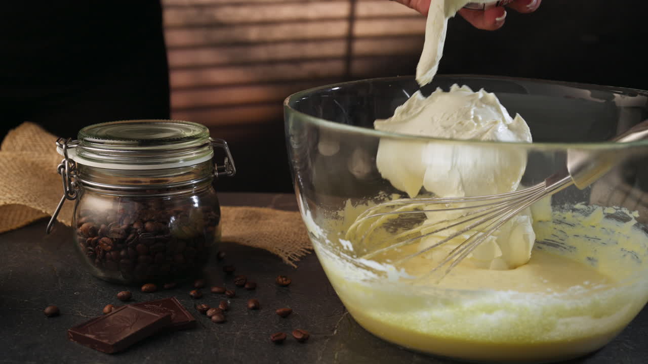 Mascarpone Cream Getting Mixed To Make Tiramisu. - closeup shot