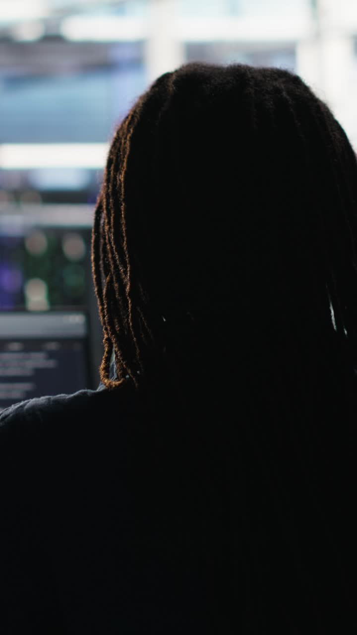 Vertical Video Data Center Engineer Using Algorithms To Analyze Datasets, Putting On Headphones