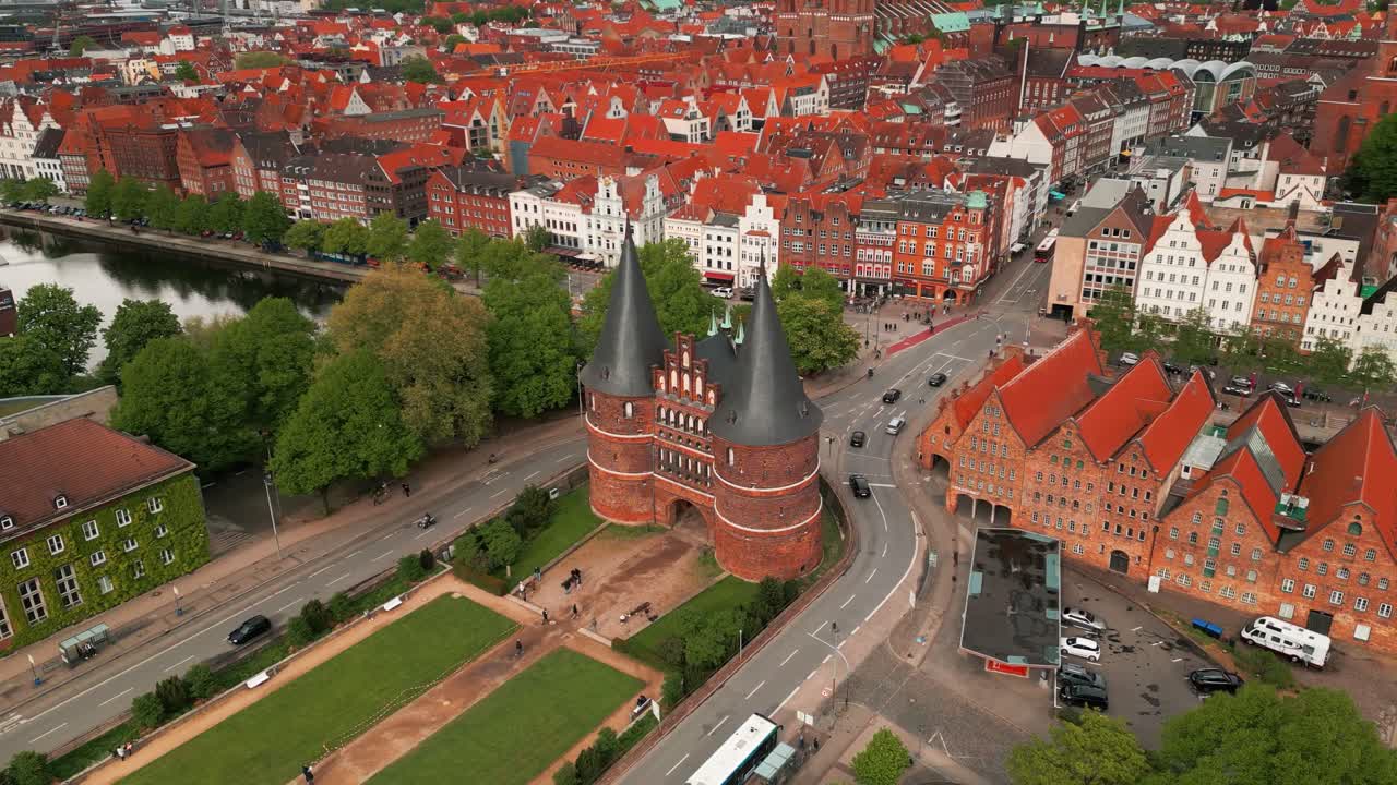 aerial shot arounf holstentor historic gate and salzspeicher revealing the city center of Lubeck on an overcast day, Lubeck city, Schleswig-Holstein land, Germany