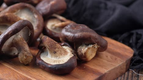 close-up of fresh shiitake mushrooms on a wooden cutting board