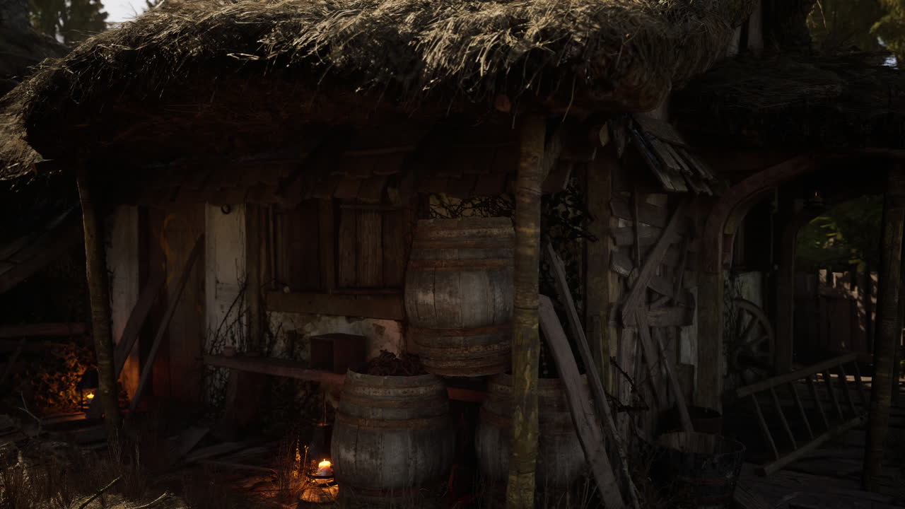Rustic thatched roof cottage with wooden barrels and warm lantern light at dusk