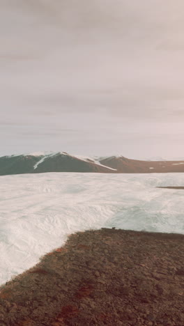 aerial view of a snowy mountain range in winter