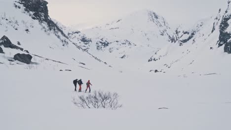 skiers enjoy hike on snowy landscape of norway, vatnahalsen