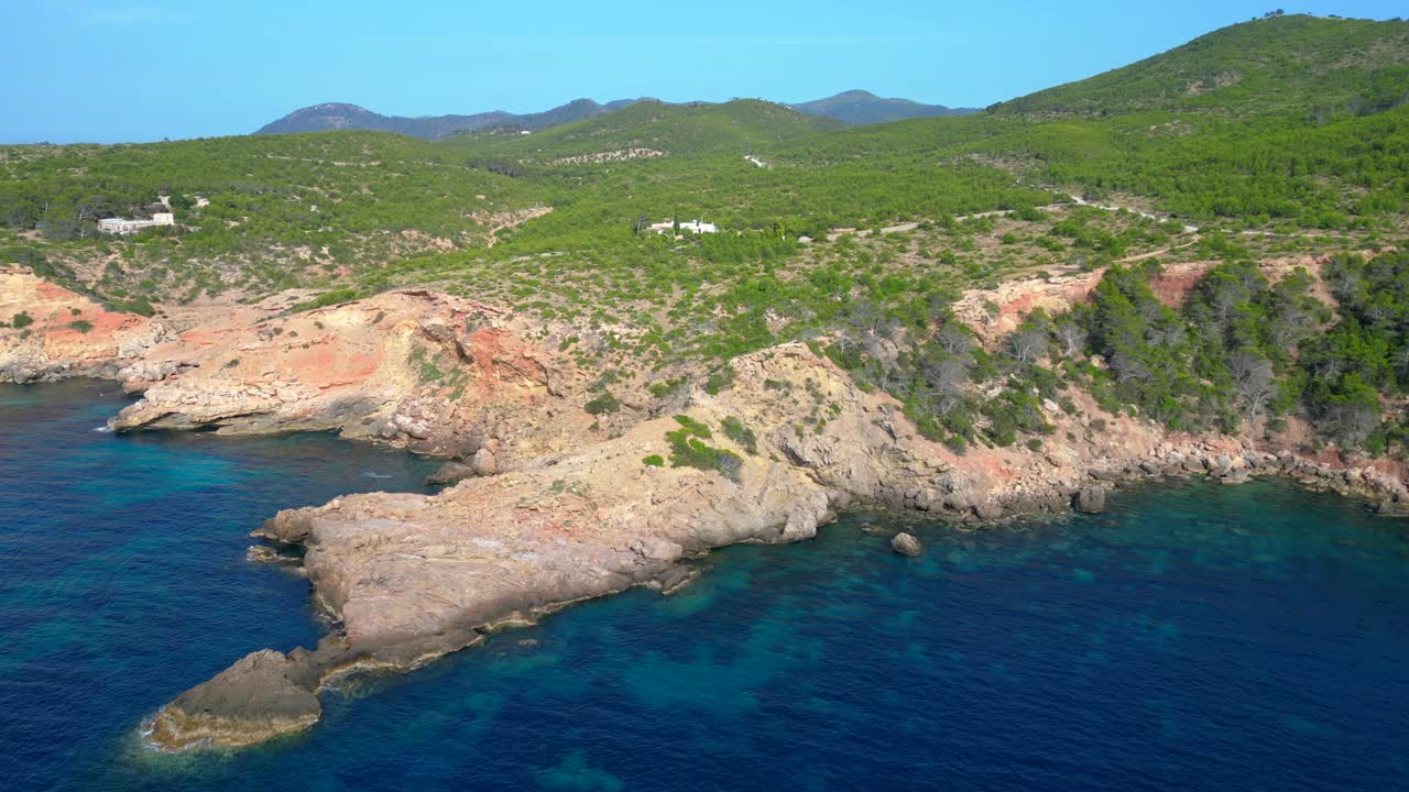 Ibiza coastline, showcasing the rugged cliffs and crystal clear turquoise waters of the mediterranean sea. Perfect aerial view flight panorama overview drone