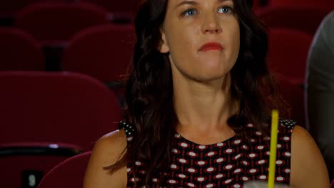 woman watching movie in theater 4k