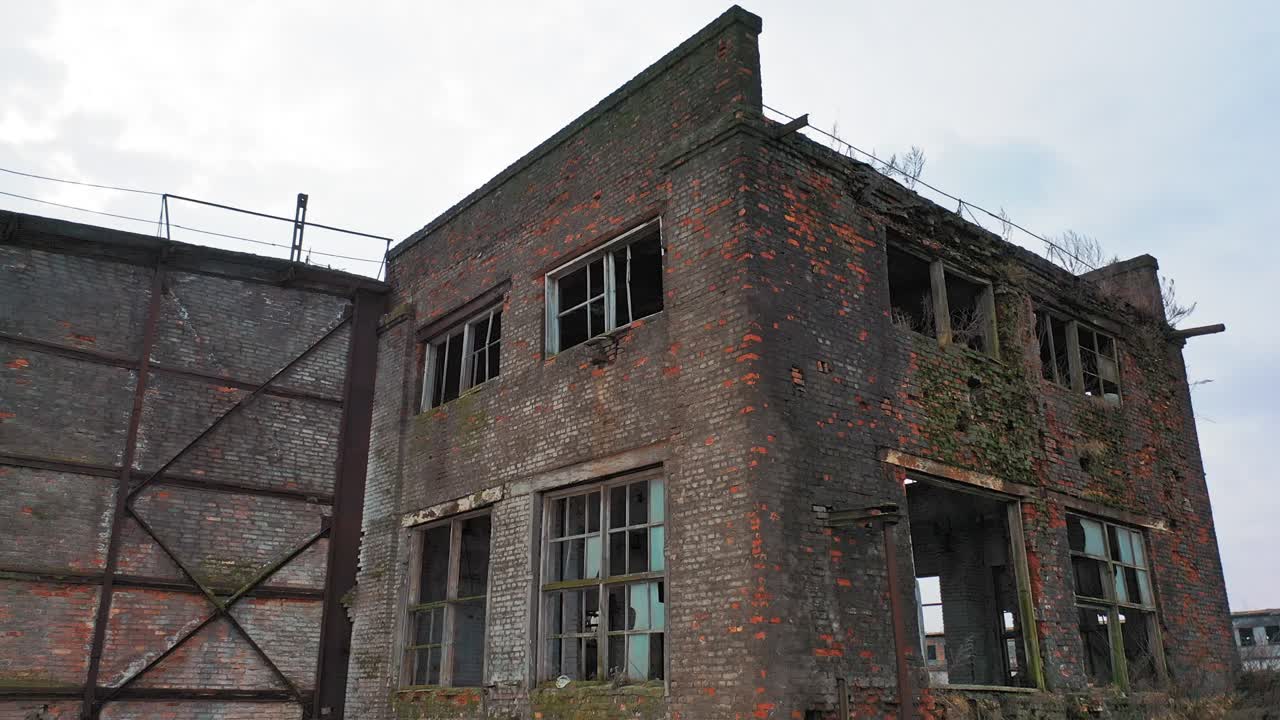 Flight over the destroyed factory. Old industrial building for demolition. Aerial view