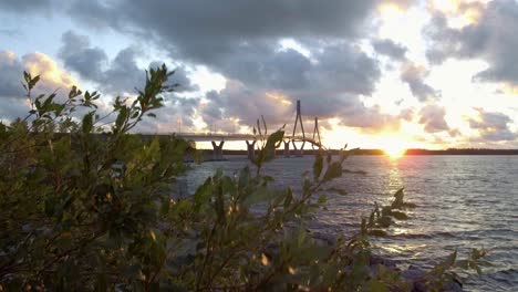 long cable stayed bridge revealed at golden hour, beautiful view of unesco world heritage with nature and architecture pieced together, the land of de geer moraines kvarken archipelago