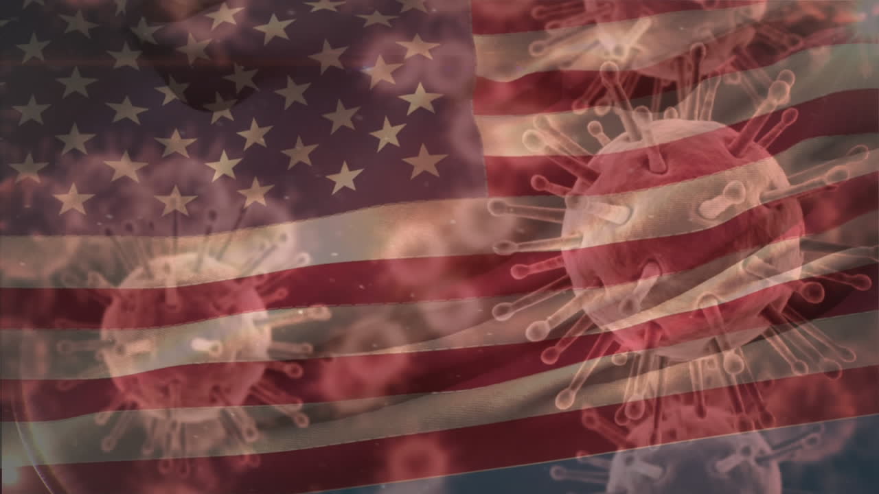 움직이는 미국 국기 위에 퍼지는 거대 코로나바이러스 코로나19 세포의 애니메이션