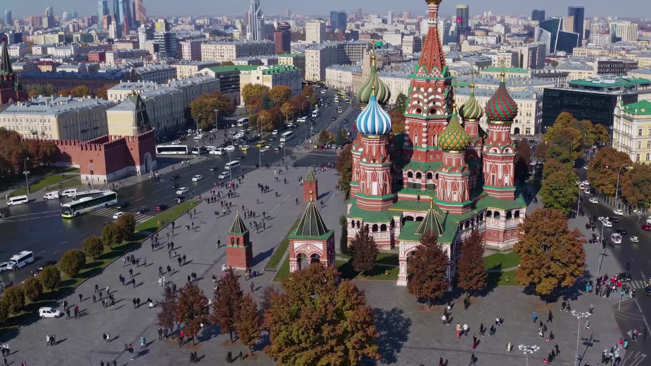 Aerial video captures a vibrant cityscape with a historic cathedral in the foreground