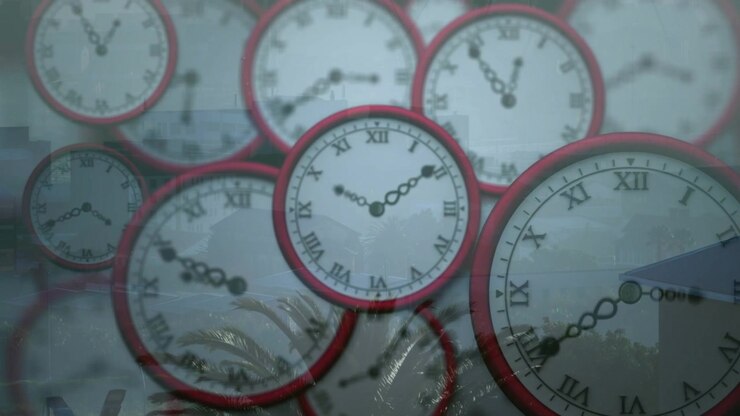 Frames advancing red-rim clocks central clock hands turning clockwise showing reflected palm and t